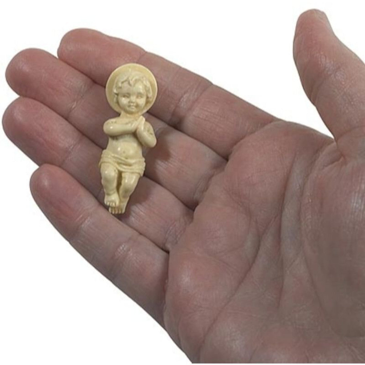 Small detailed Christ Child figurine in natural color plastic, ideal Christmas season keepsake or souvenir item.